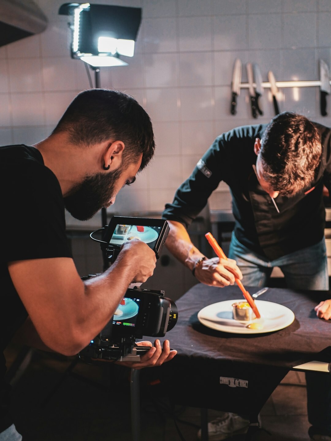Production team planning a live broadcast around a table