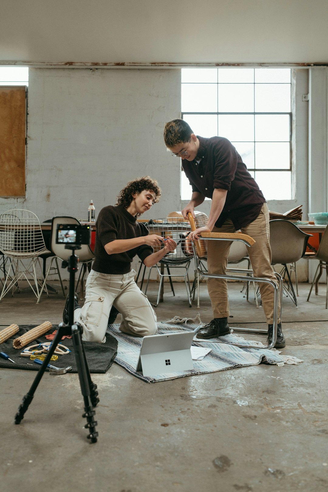Students practicing hands-on camera operation during a workshop